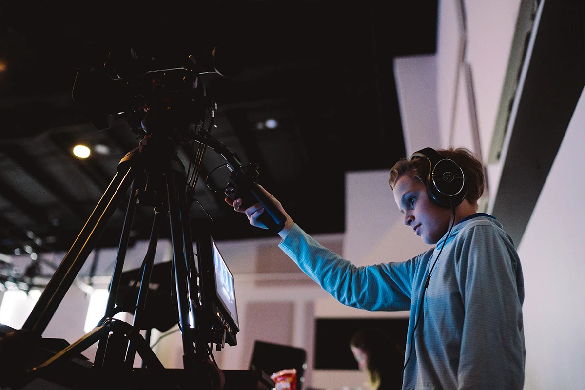 Young woman running a video camera. Young woman running a video camera.