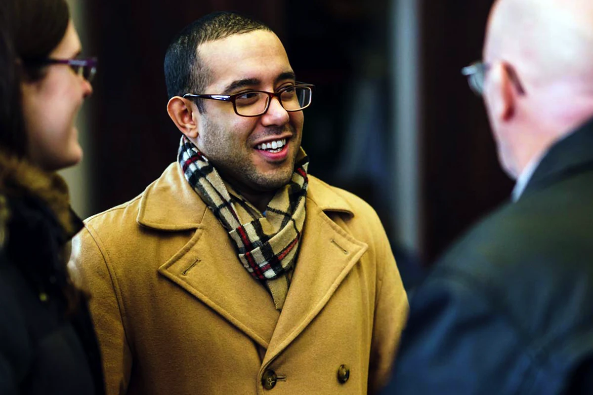 Young woman running a video camera.