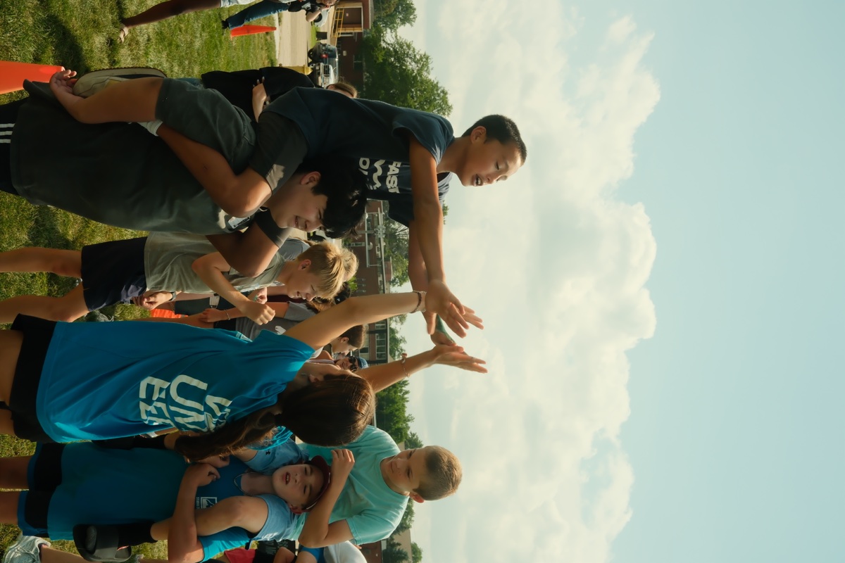 Gospelife Students playing an outdoor team game at camp