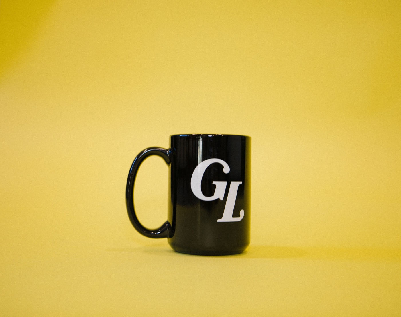 A black mug with the Gospelife GL logo